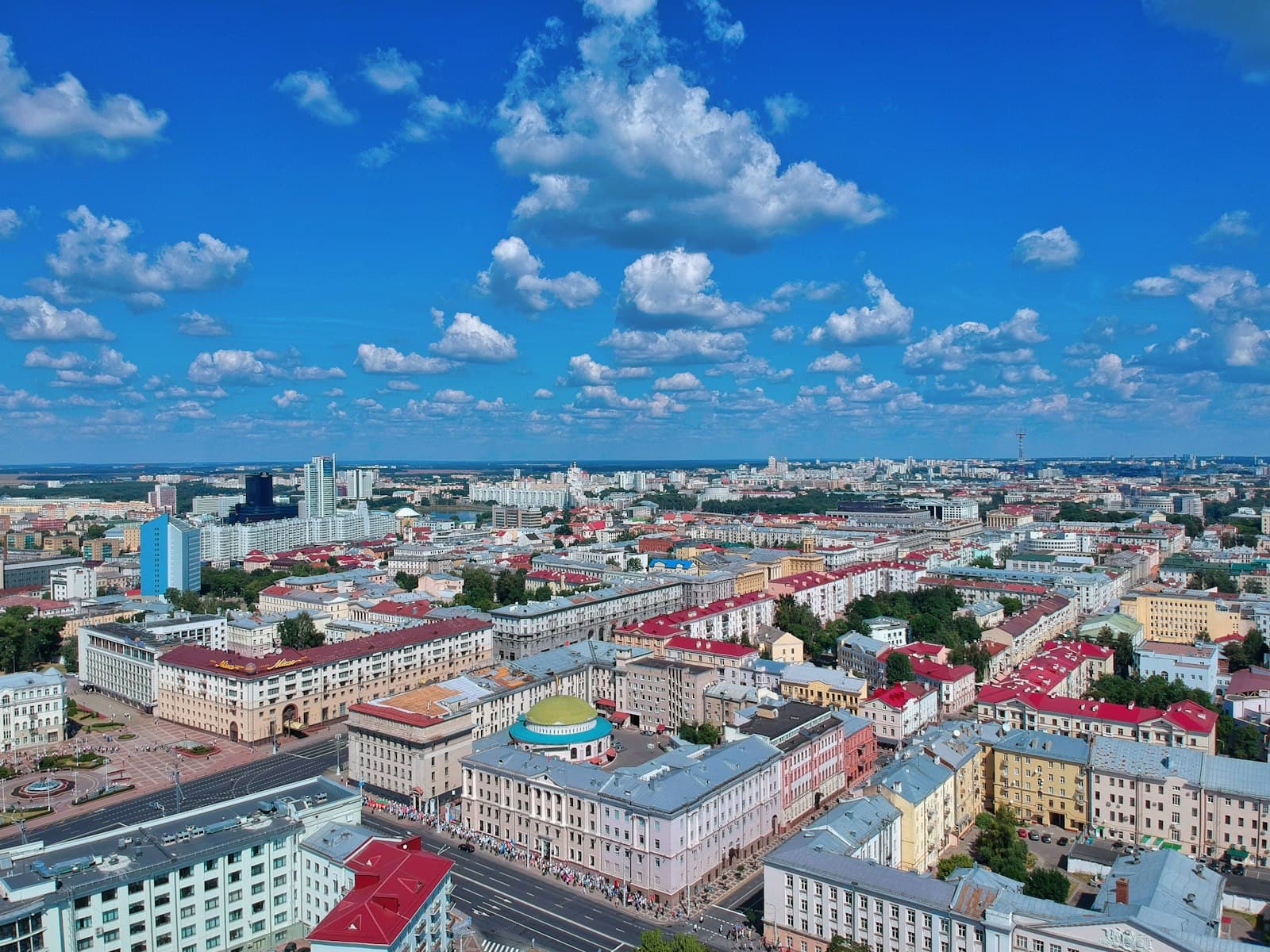 Aerial view of Minsk, Belarus — modern city buildings under a wide blue sky