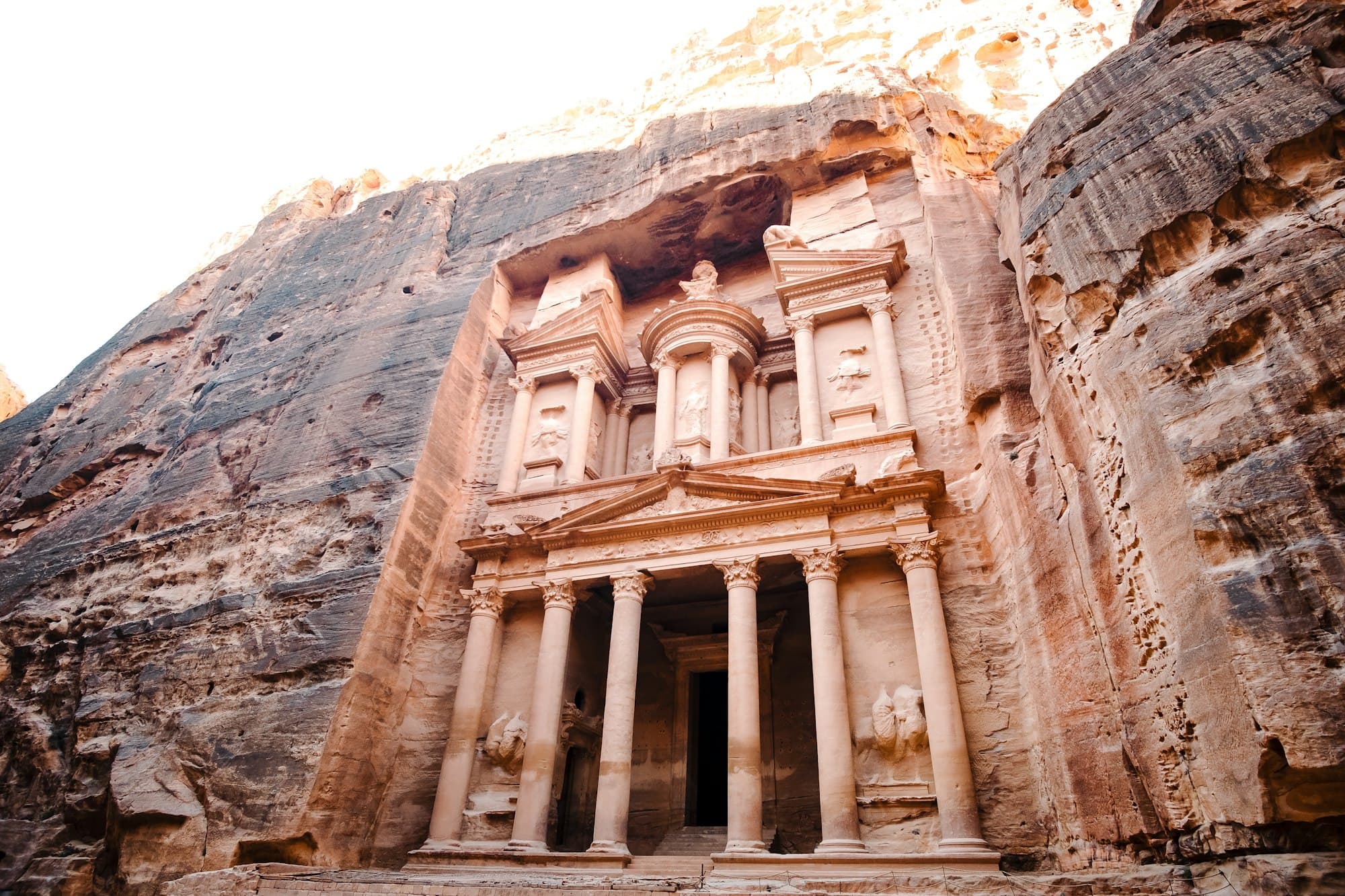 The Treasury, Al-Khazneh, carved into the sandstone cliffs of Petra, Jordan