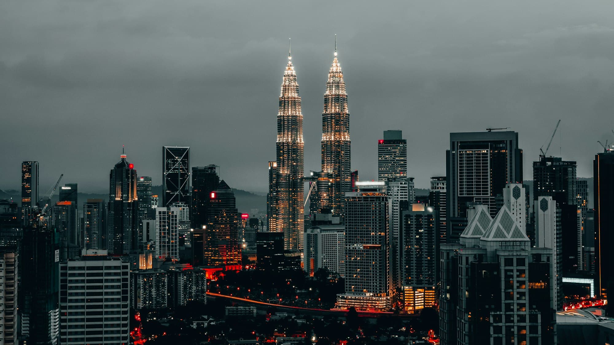 Petronas Twin Towers rising above the Kuala Lumpur skyline at dusk, Malaysia